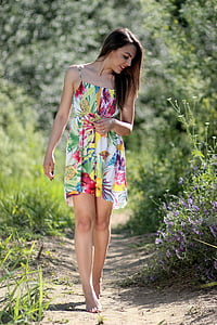 woman wearing white, green, and red floral spaghetti strap sundress thumbnail