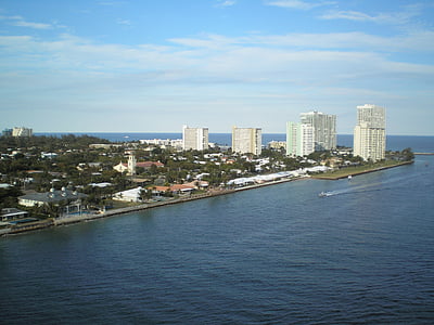 aerial photography of city beside water thumbnail