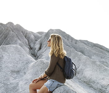 woman sitting on rock thumbnail