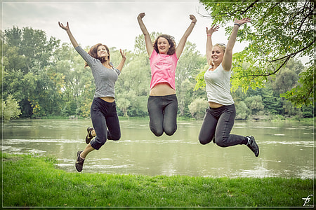 women taking jumpshot photo during daytime thumbnail