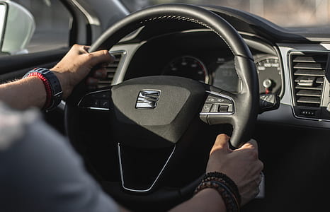 person holding steering wheel of SEAT car thumbnail