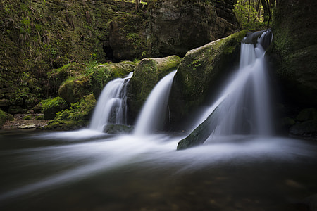 closeup photography of green mountain and falls thumbnail