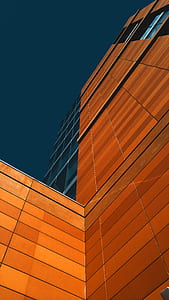 worms eye view of brown building during daytime thumbnail