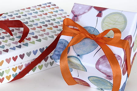 white, green, and purple gift boxes thumbnail