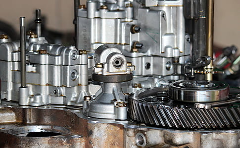 person taking photo of gray steel machinery thumbnail