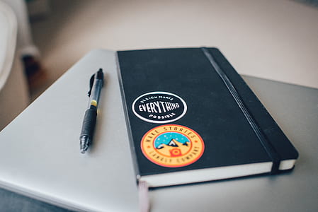 black Everthing book near click pen thumbnail