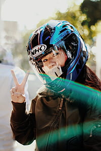 woman doing peace sign taking selfie thumbnail