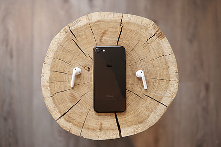 flat-way photography of black iPhone 7 and AirPods thumbnail
