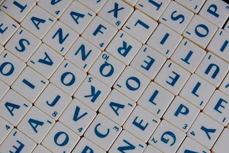 white and blue scrabble letter piece thumbnail