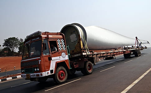 photo of brown freight truck on road thumbnail
