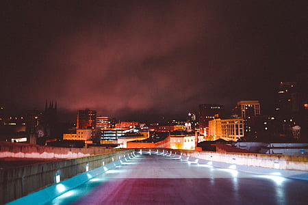 road leading to building during night time thumbnail