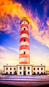 red and white concrete lighthouse tower photo thumbnail