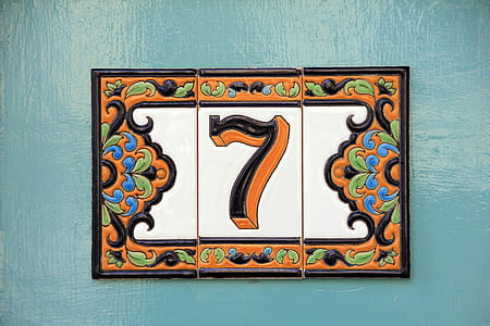 white, black, and orange 7 signage thumbnail