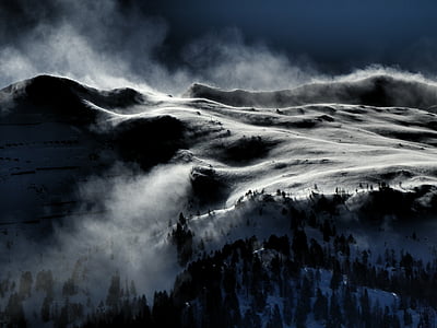 brown mountains covered by snow at daytime thumbnail