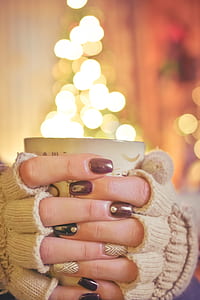 person holding white ceramic coffee mug thumbnail