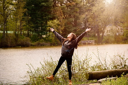 Photography of a Woman Near Lake thumbnail