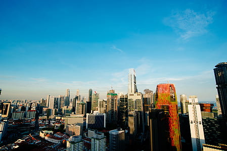 high-angle photograph of cityscape under blue sky thumbnail