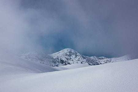 snow mountain under cloudy sky during daytime thumbnail