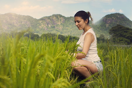 woman sitting surrounded by plants thumbnail
