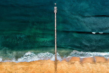 Aerial Shot of Gray Dock on Body of Water thumbnail