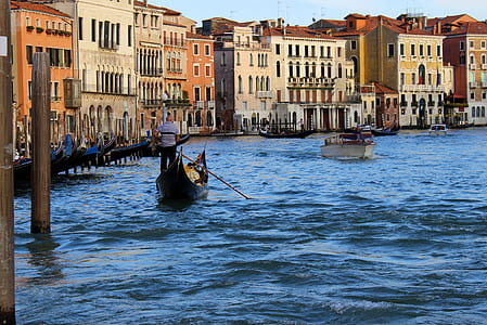 two brown boats on body of water thumbnail