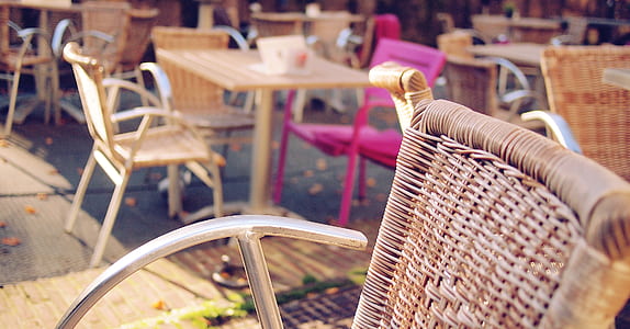 brown wicker chair during day tie thumbnail