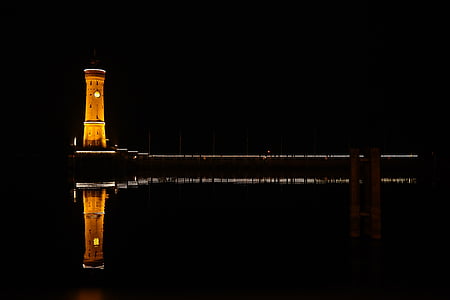 landscape photo of lighthouse during nighttime thumbnail