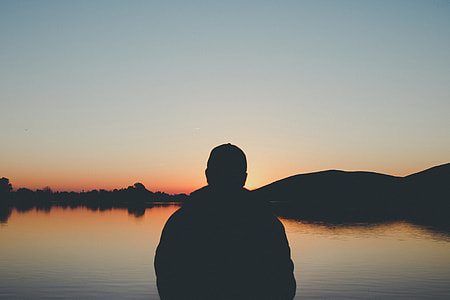 Silhouette of a man at sunset thumbnail