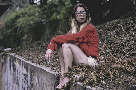 woman sitting on dried leaves thumbnail