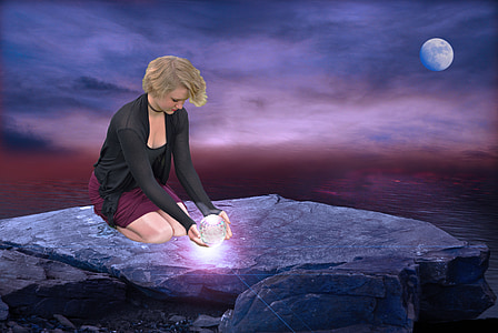 woman wearing black cardigan kneeling on gray stone thumbnail