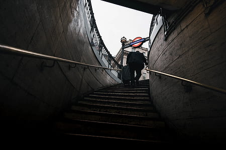 person carrying bag walking on stair underground thumbnail