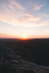 aerial photo of rocky mountains during sunset thumbnail