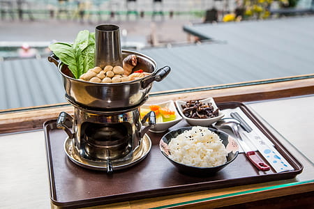 rice in bowl on brown tray thumbnail
