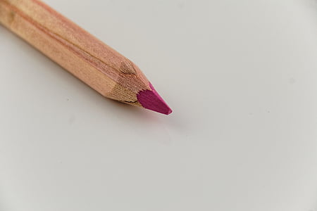 pink pencil on white surface close-up photo thumbnail