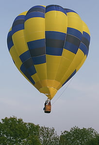 yellow and blue hot air balloon on sky thumbnail