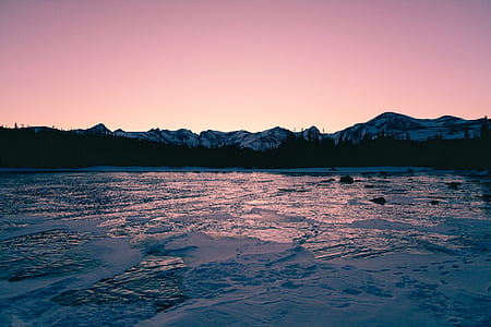 body of water near on mountain thumbnail