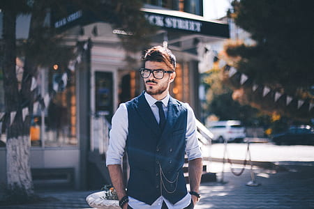 man standing near gray and brown structure thumbnail