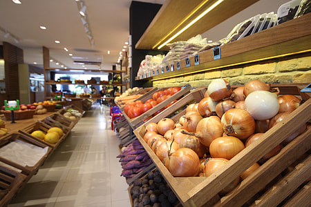 selective focus photography of brown onions in brown wooden crate thumbnail