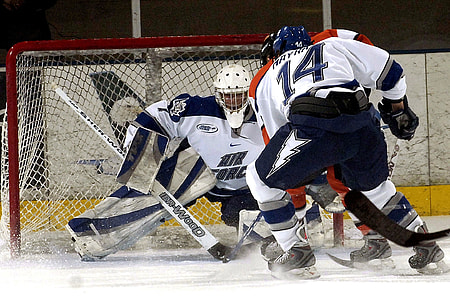ice hockey player guarding the net goal thumbnail