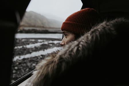 person wearing red knit cap thumbnail