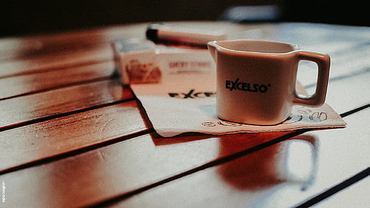 White Ceramic Mug on Table thumbnail