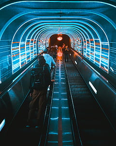 people standing on escalator inside the tunnel thumbnail