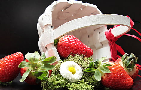three strawberries near white wicker basket thumbnail