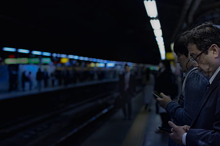 selective focus photography of people waiting on train thumbnail