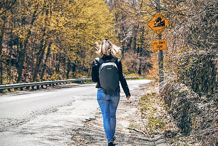 woman wearing black shirt and blue jeans thumbnail