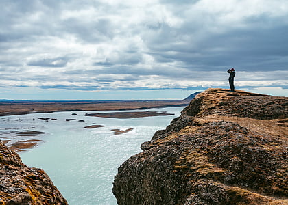 person standing on top of hill thumbnail