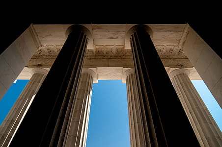 beige concrete pillars in building thumbnail