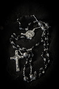 gray rosary on black surface thumbnail