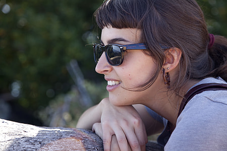woman wearing black sunglasses in close up photography thumbnail