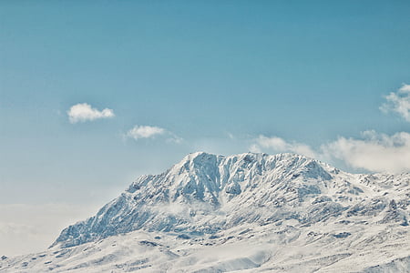 snow covered mountain during daytime thumbnail